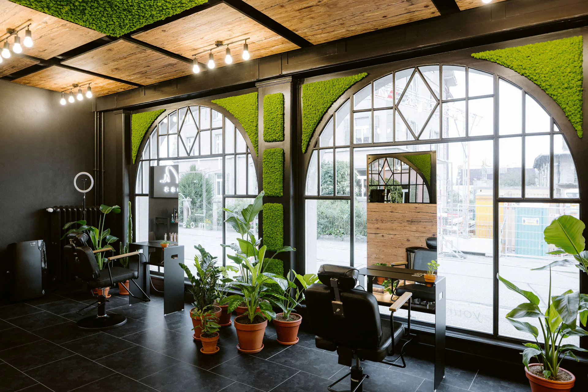 A moss wall in a modern office lounge