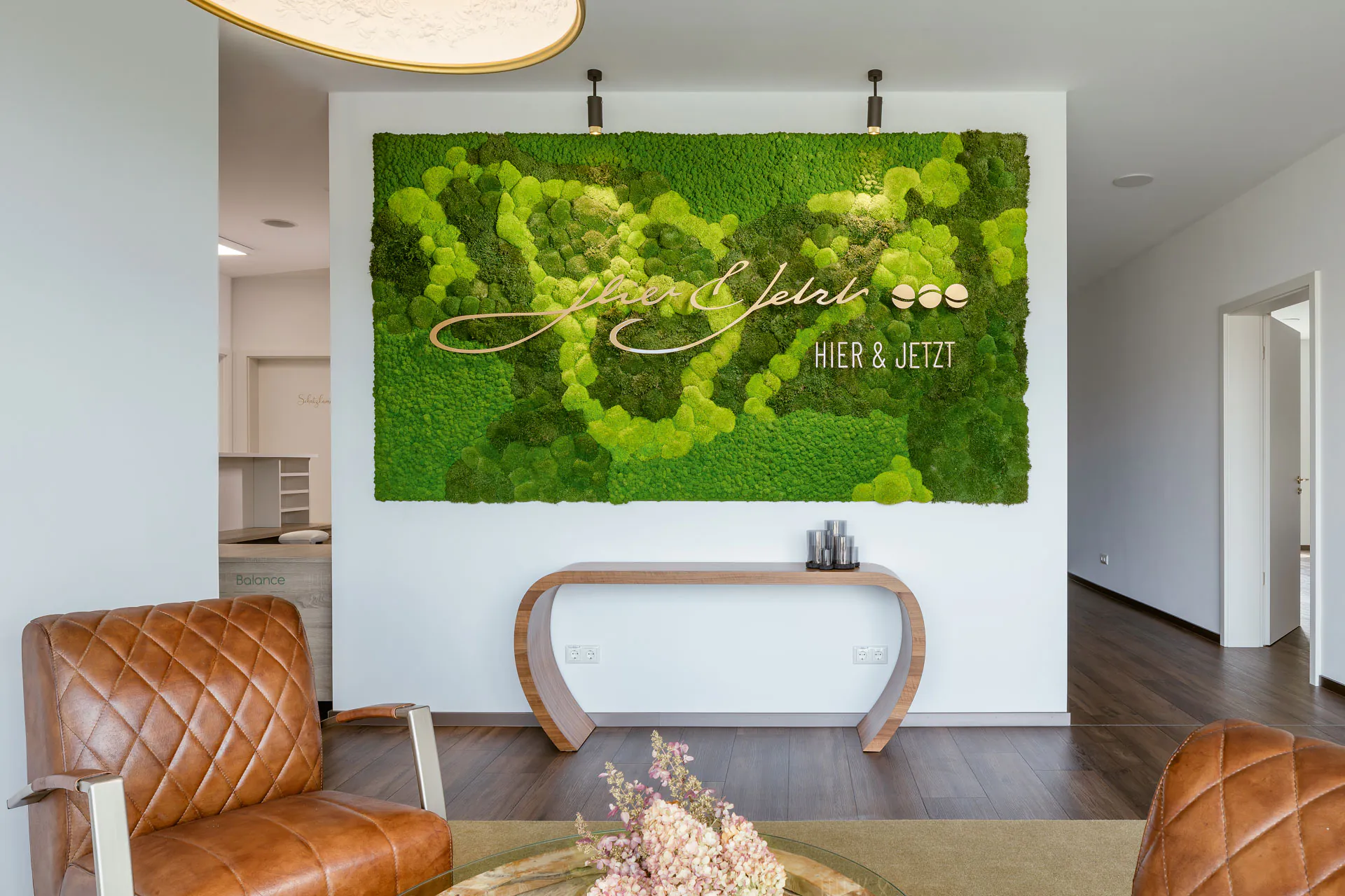 Moss wall with logo — brand logo as an inlay in the reception area
