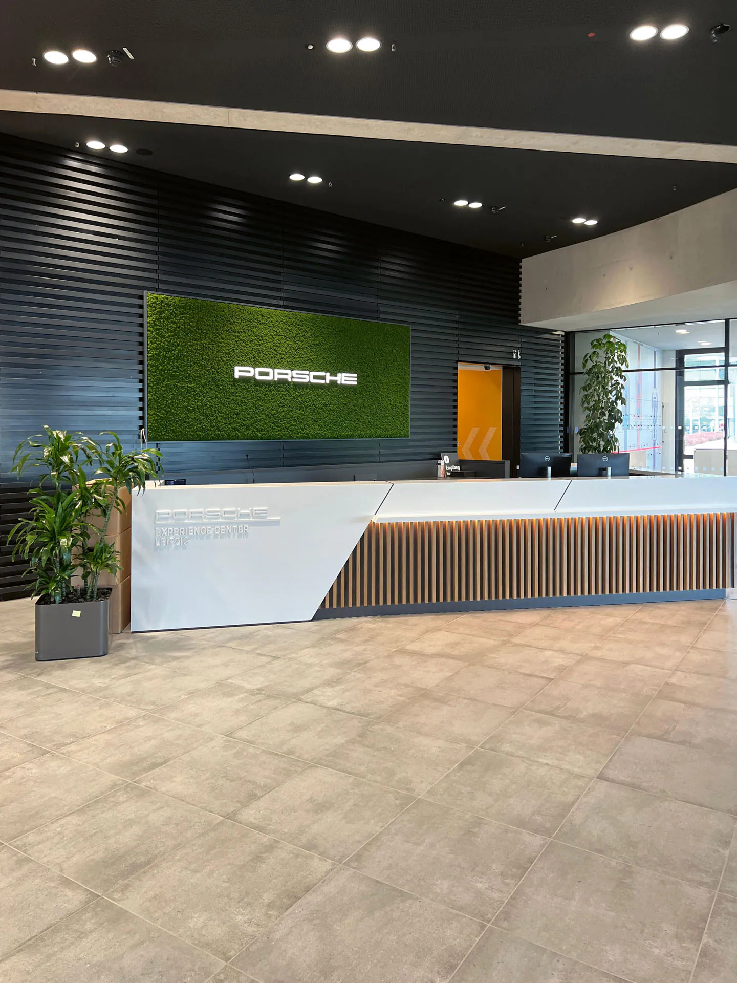 Brand logo · Porsche showroom