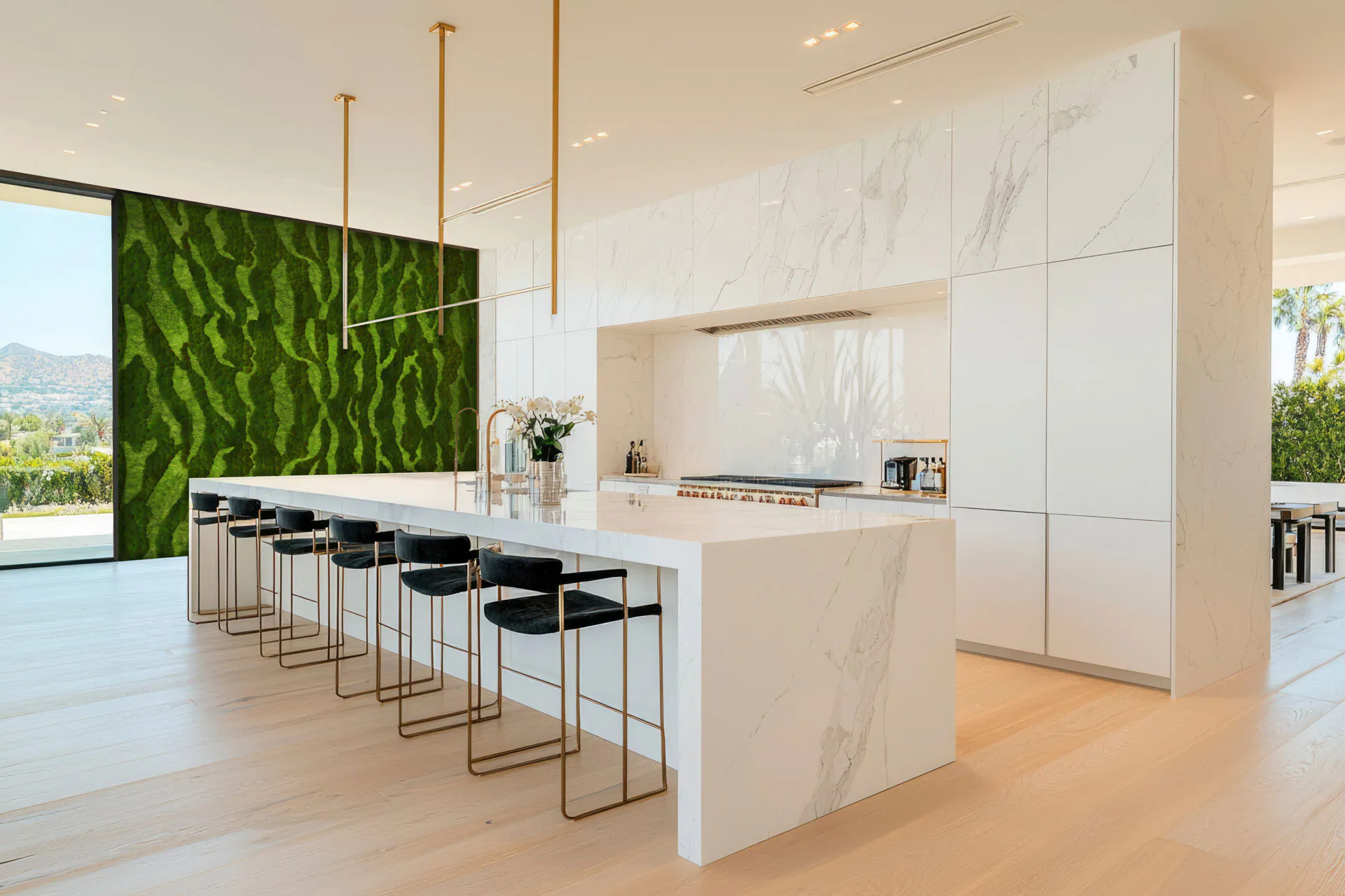 Kitchen showroom display featuring a Moss wall next to a modern designer kitchen
