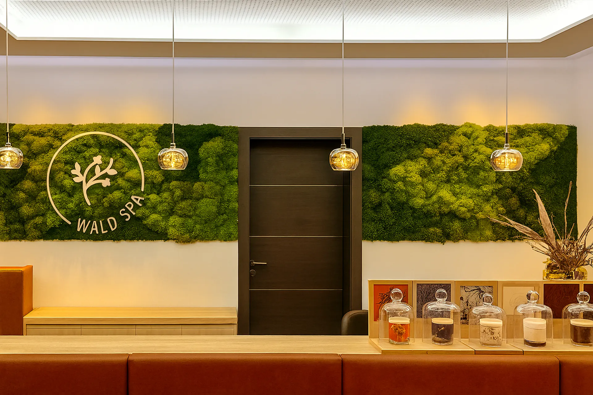 Logo made of moss at the Moos Wellness Spa showroom reception — Logo made of moss by MOOSMOOS