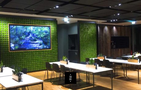 Wall from single moss bales in a restaurant
