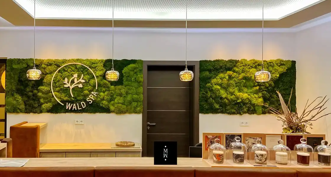 a room with a door and plants on the wall