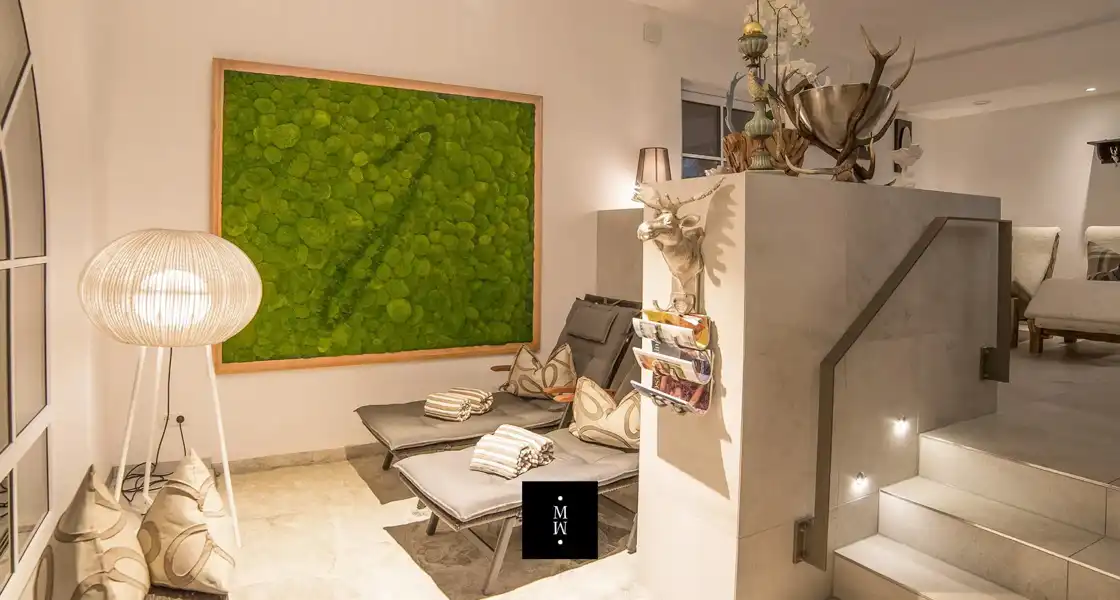 a room with a large painting on the wall