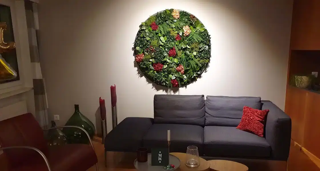 a living room with a couch and a wall art