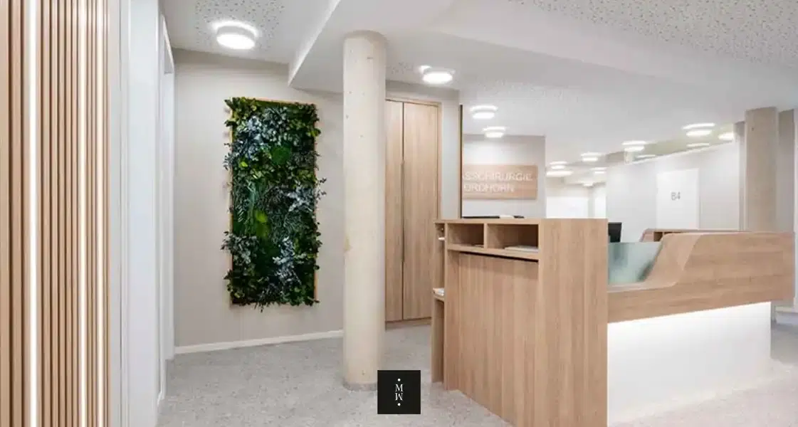 a room with a green wall and a wooden counter