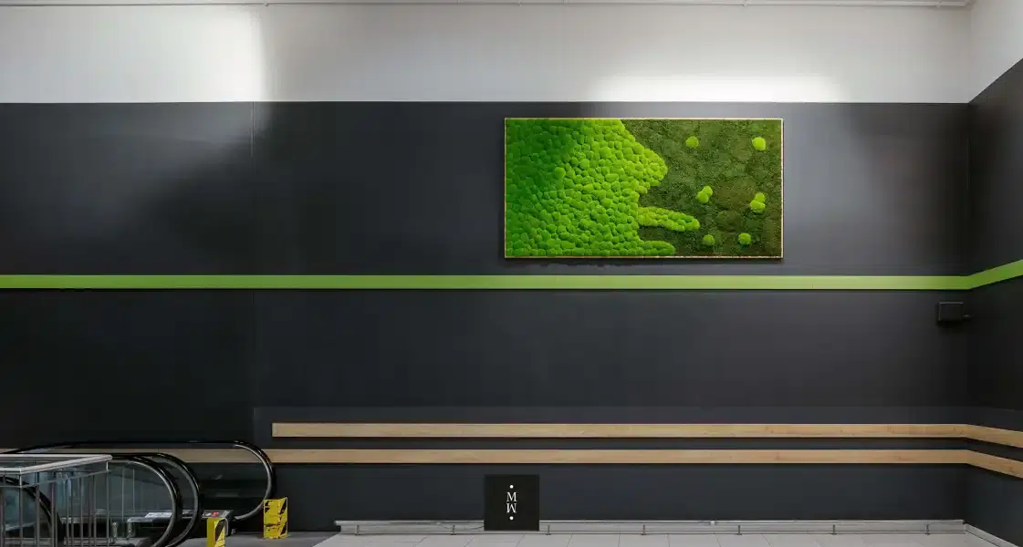 a green art on a wall