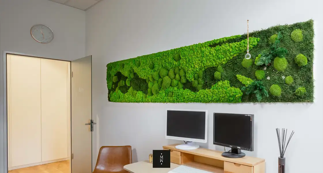 a green wall art on a wall
