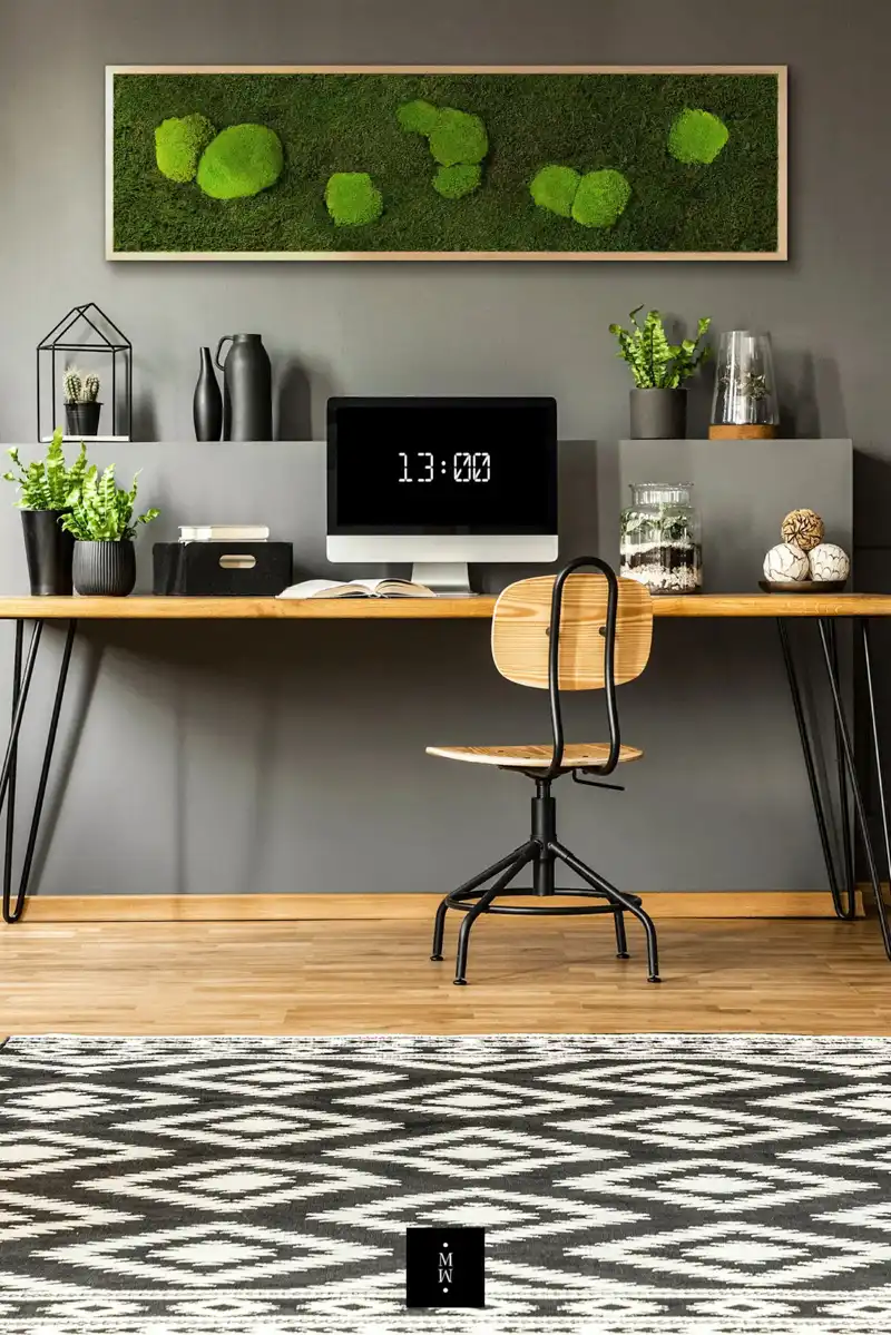 a desk with a computer and a chair