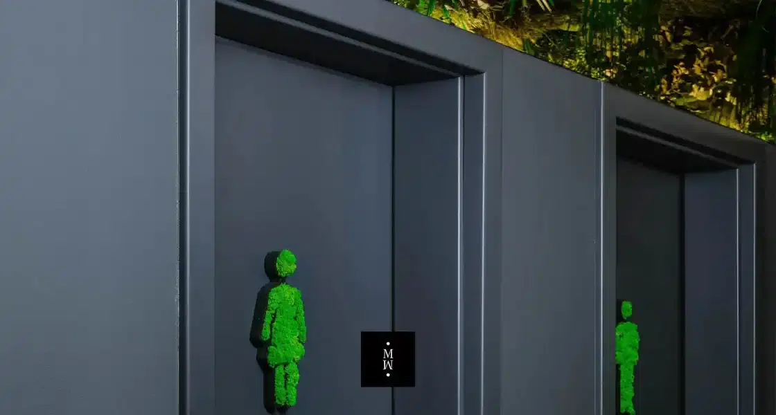 a green figure on a wall