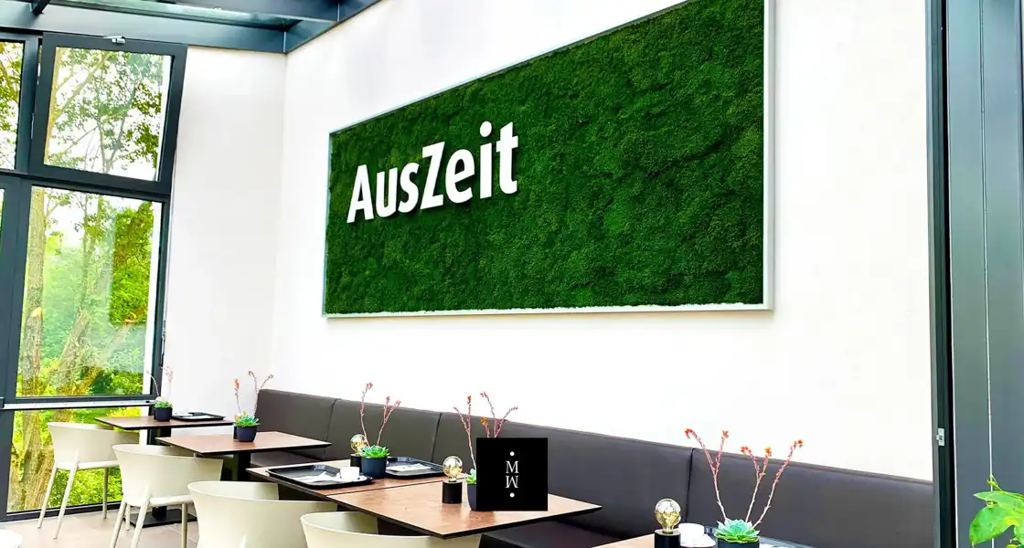 a green wall with white text on it