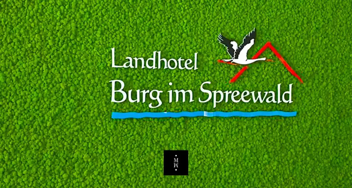 a logo on a green surface