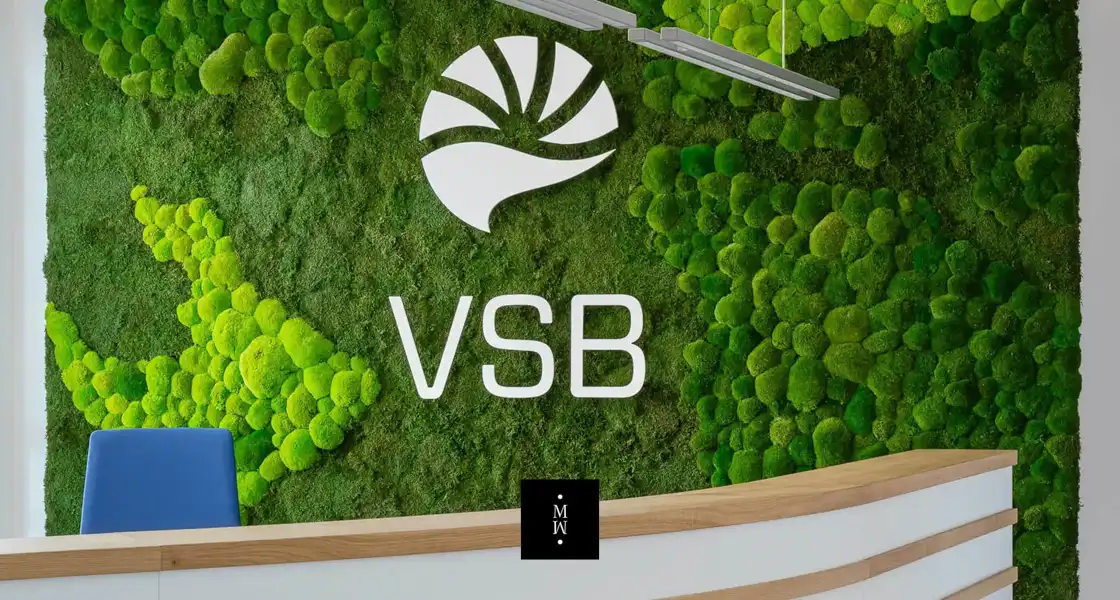 a green wall with white text and white letters