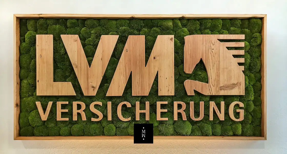 a sign with letters and text on it