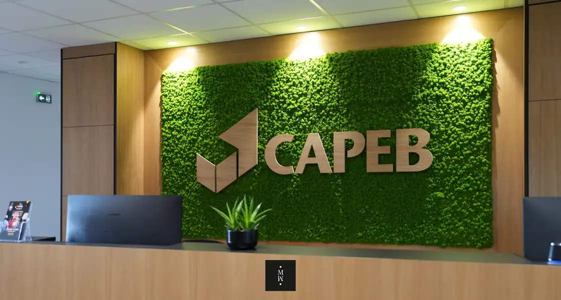 a green wall with a sign on it