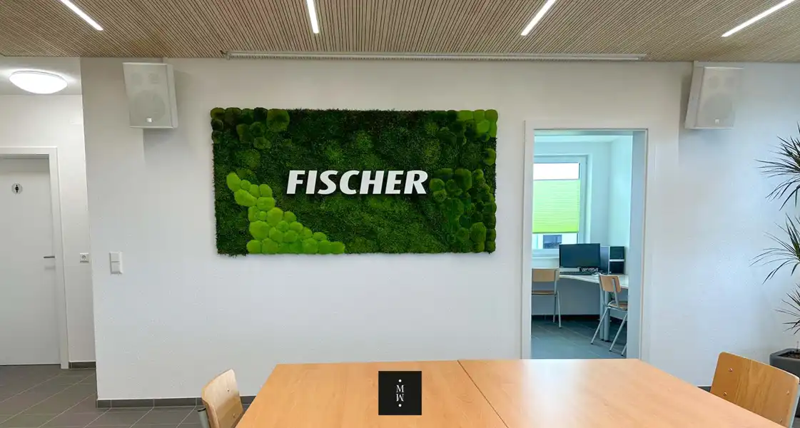 a green wall with white text on it