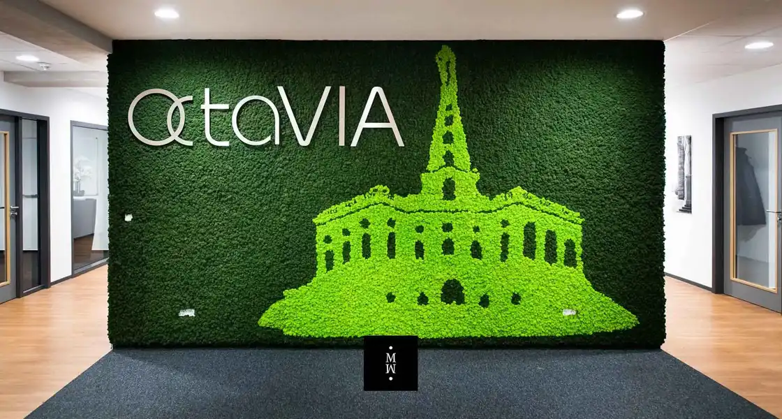 a green carpet with a picture of a building and a tower