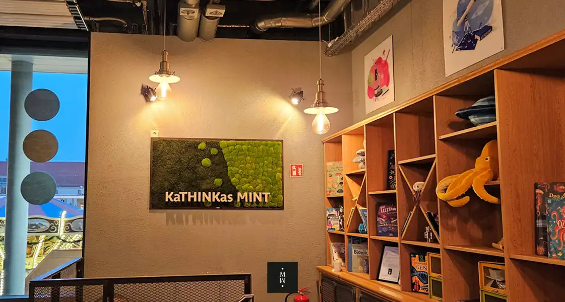 a room with a bookcase and a sign