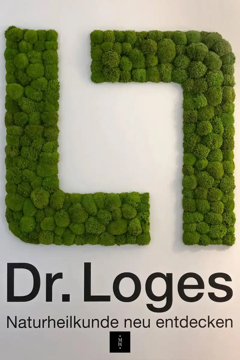 a sign with a green plant