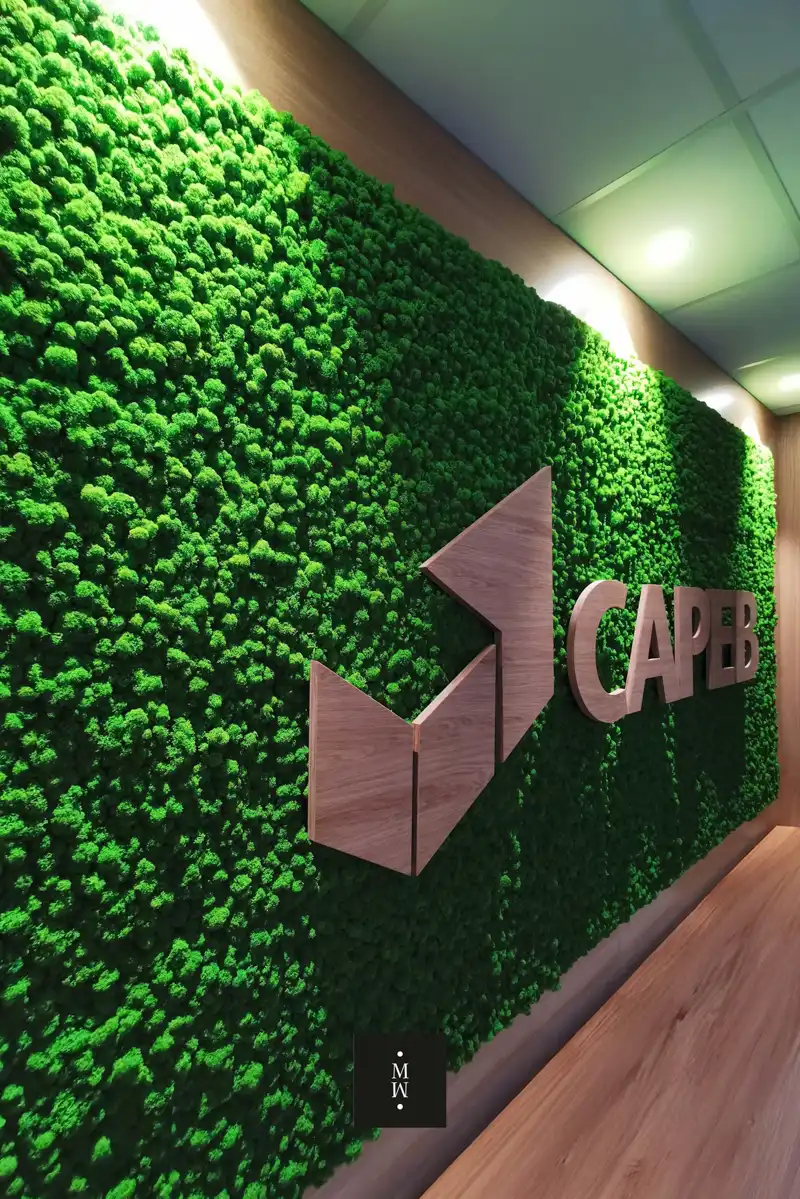 a green wall with a logo on it
