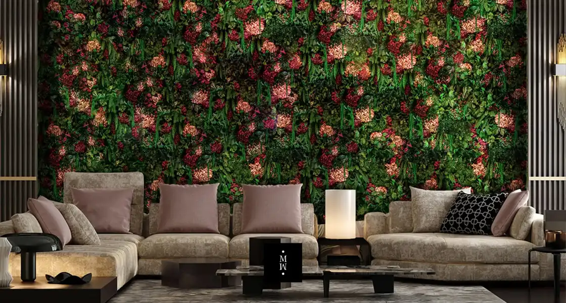 a couches and coffee tables in a room with a wall of plants