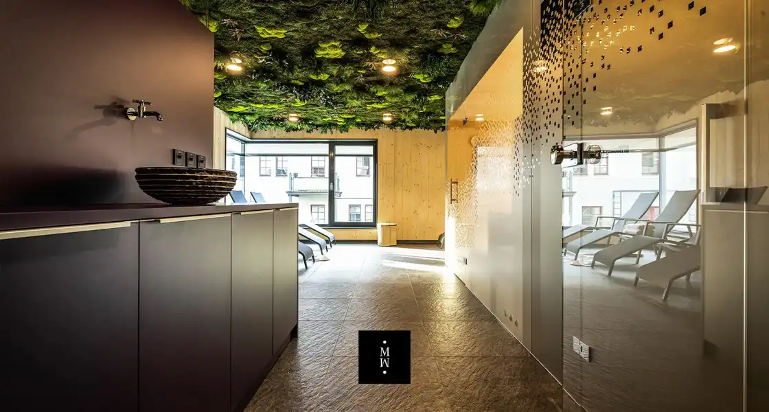 a room with plants on the ceiling