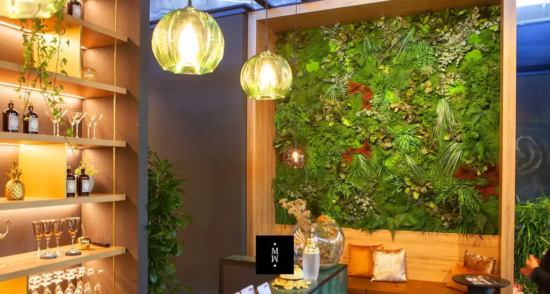 a green wall with plants and lights