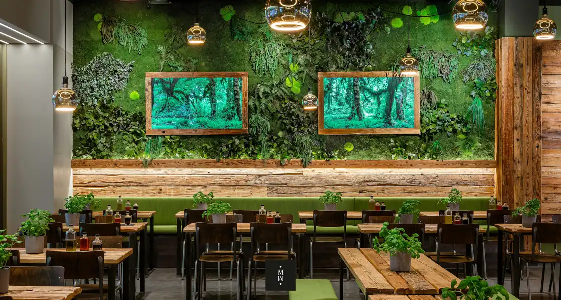 a room with green walls and plants