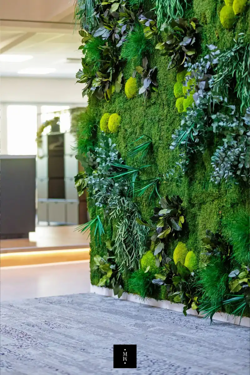 a green wall with plants