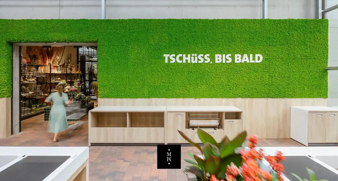 a green wall with white text