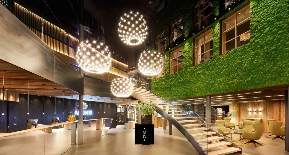 a staircase in a building with lights from the ceiling