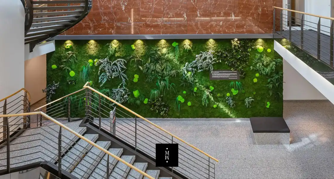 a staircase with plants on the wall