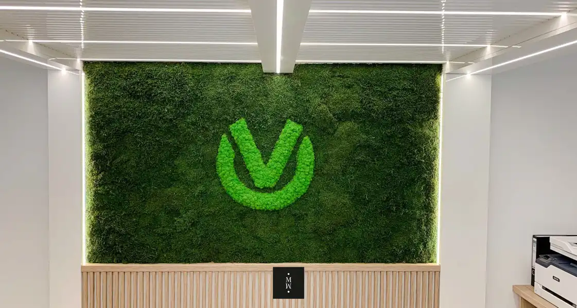 a green logo on a wall