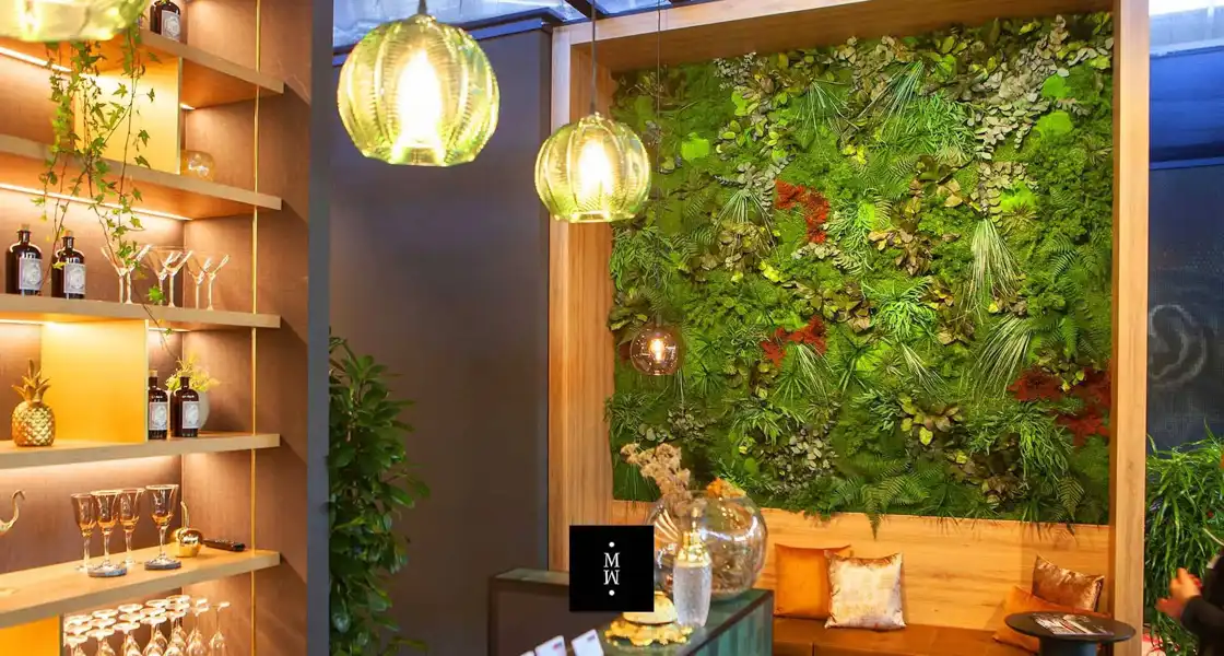 a green wall with plants and lights