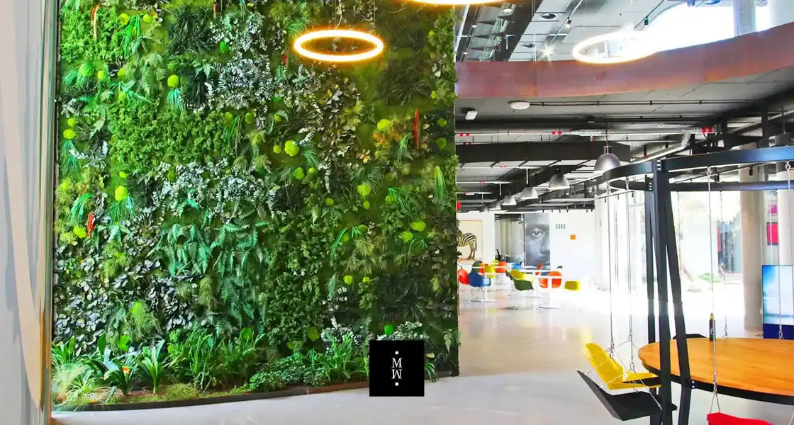 a green wall with plants in it