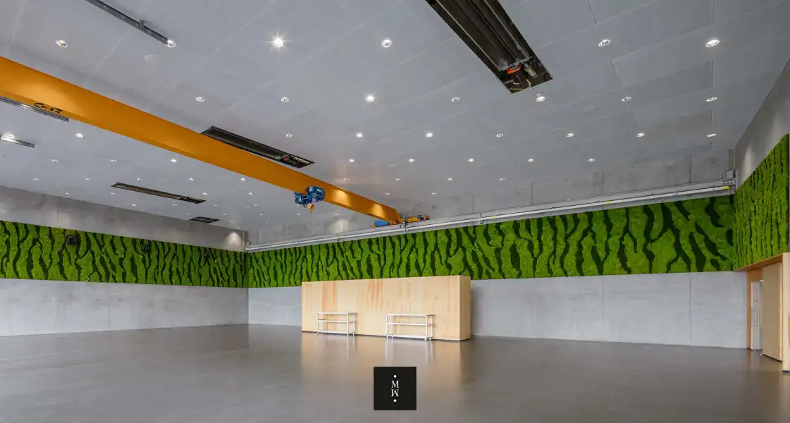 a room with a wall and a wooden table