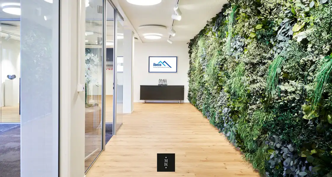 a room with plants on the wall