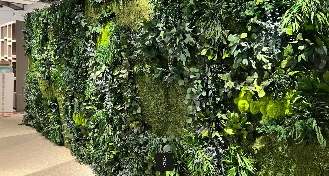 a wall of plants and flowers