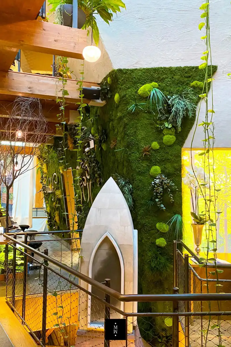 a green wall with plants on it