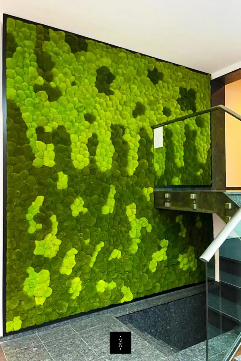a green wall with a railing