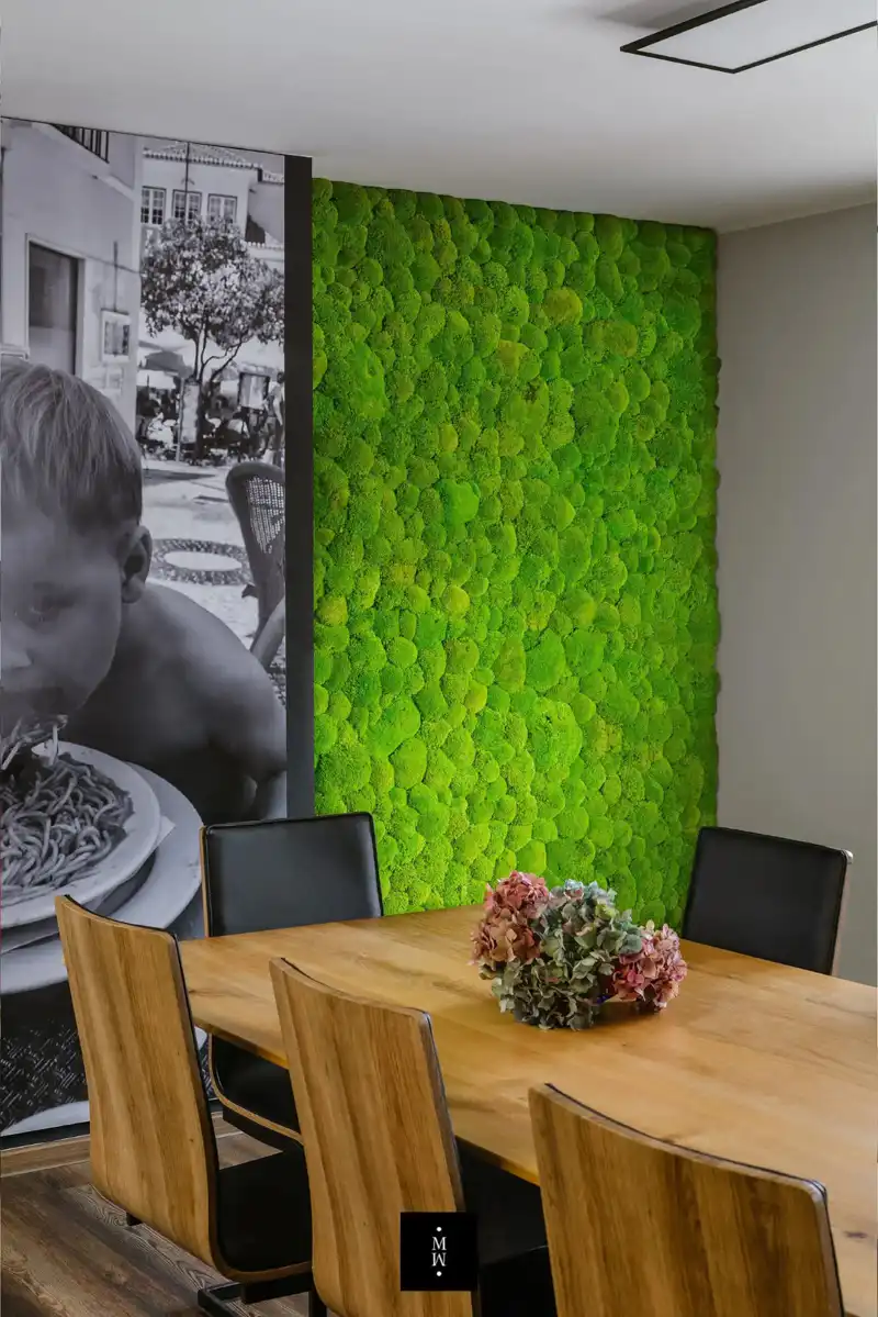 a table and chairs in a room with a picture of a boy