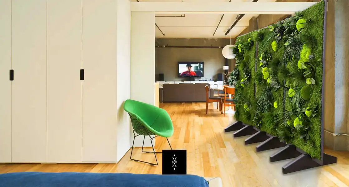 a room with a green wall and a tv