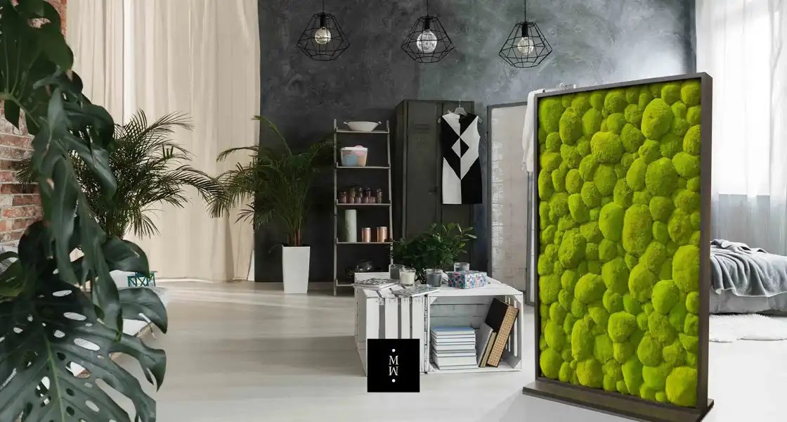 a room with a large screen and a white table