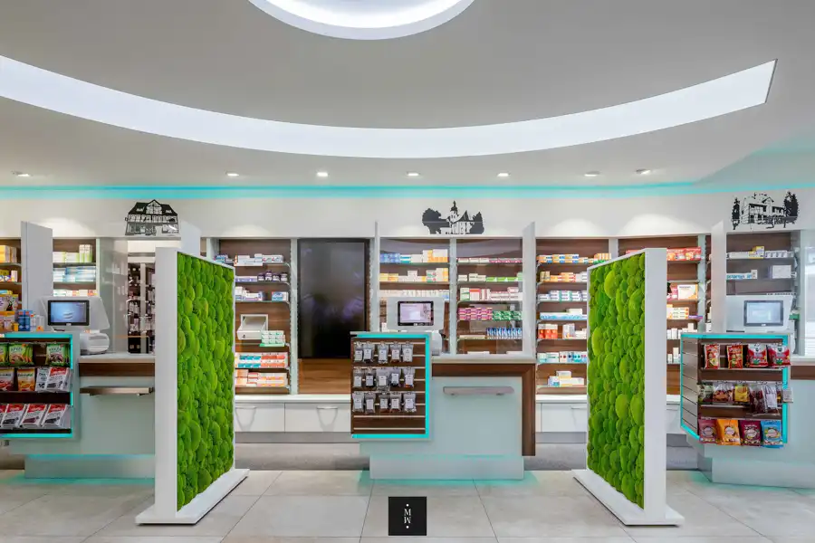 a pharmacy with green plants on display