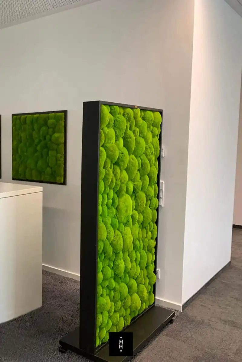 a green wall art in a room