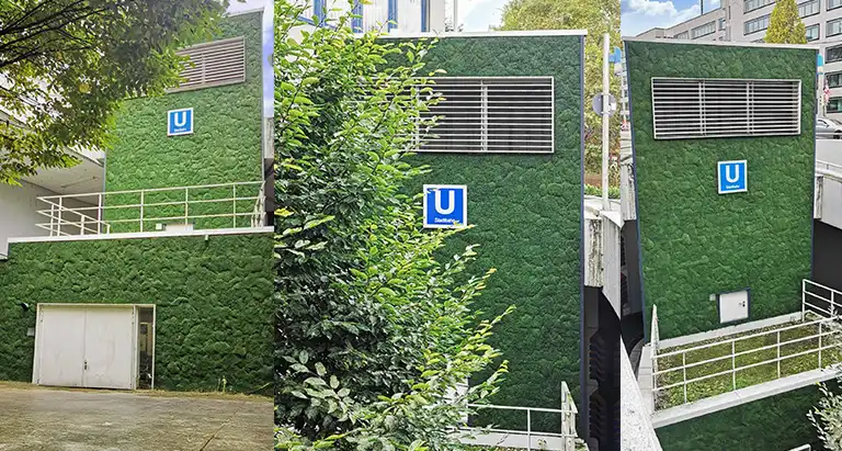 Gebäude der Stuttgarter U-Bahn mit grüner Moosfassade als nachhaltige Außenbegrünung